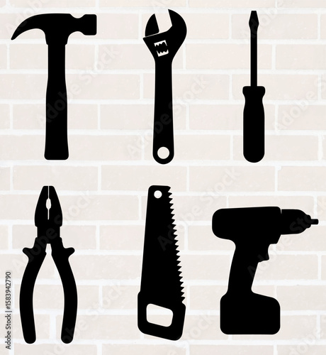 Hand tools for repair on brick wall background