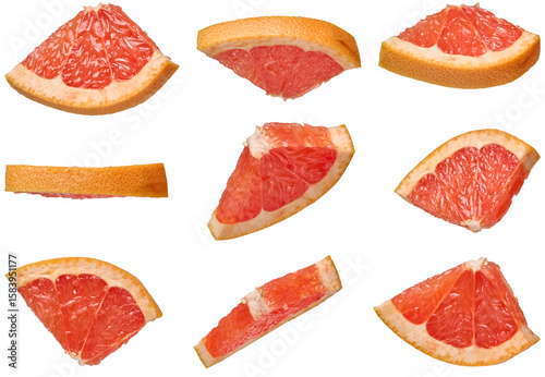 Vászonkép Triangular grapefruit slices with juicy pulp on an isolated background in differ