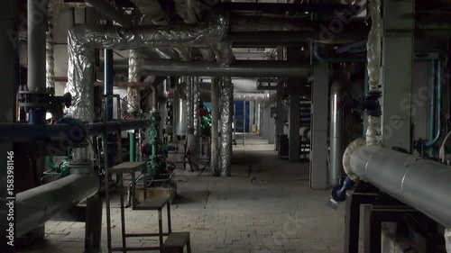 Industrial pipes inside an industrial plant building