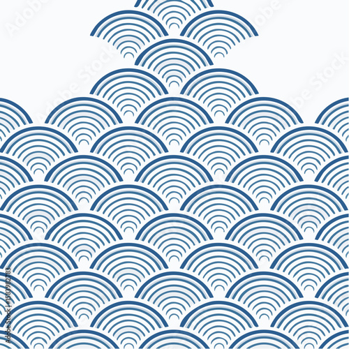 Blue and white concentric semi-circles arranged in a wave-like pattern, creating an abstract design.
