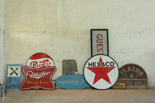 Canvas-taulu A collection of vintage-style movie advertising posters leaning against a rustic