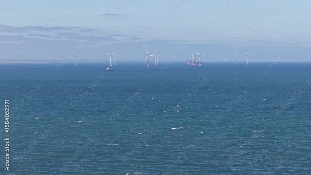 Aerial view of offshore wind turbines in the North Sea Aerial view of offshore wind turbines in the North Sea