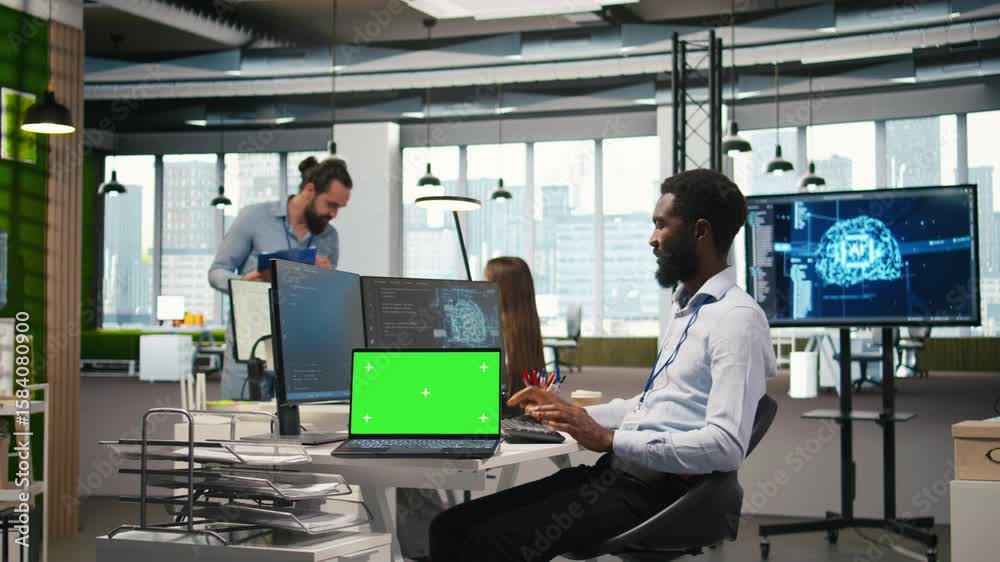 Startup office programmer using green screen laptop, developing artificial intelligence models for business analytics. IT expert using mockup notebook, running simulations for AI forecasting, camera A