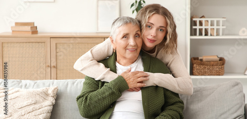 Young woman hugging her gra...
