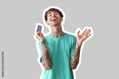 Happy young man with credit...