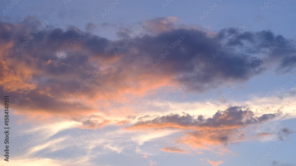 A beautiful blue sky with a pinkish hue. The sky is filled with clouds, and the sun is setting. The sky is calm and peaceful, and the colors are warm and inviting A beautiful blue sky with a pinkish hue. The sky is filled with clouds, and the sun is setting. The sky is calm and peaceful, and the colors are warm and inviting