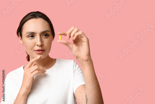 Thoughtful young woman with...