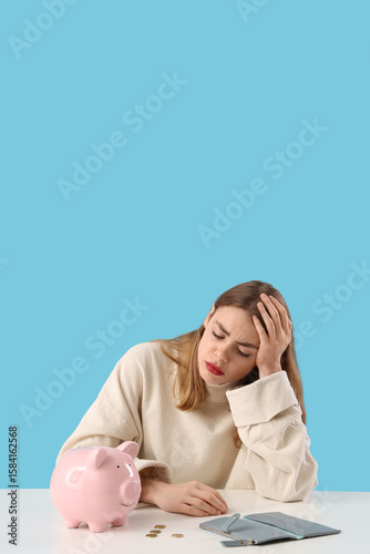 Upset young woman with pigg...