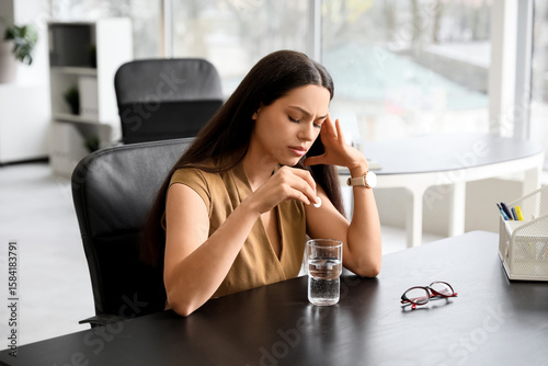 Young woman with glass of w...