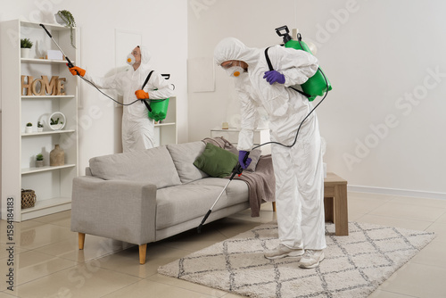 Male workers in hazmat suit...