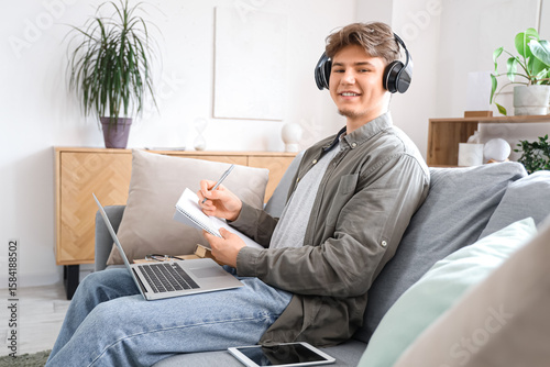 Male student in headphones ...