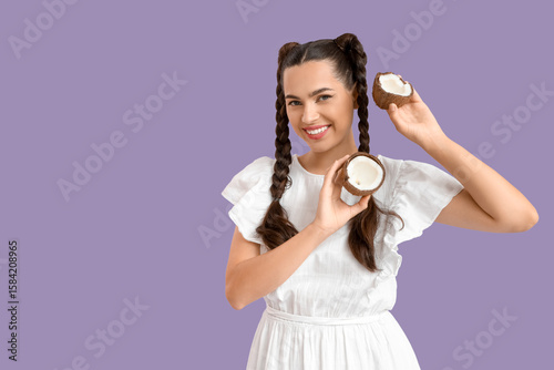Healthy nutrition and skincare concept, young woman holding fresh coconut hal...