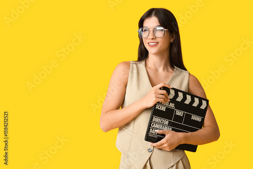 Young happy female film dir...