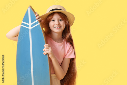 Cute girl with surfboard on...
