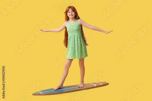 Cute girl on surfboard agai...