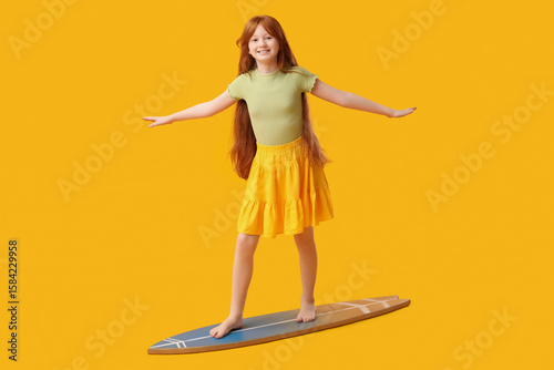 Cute girl on surfboard agai...