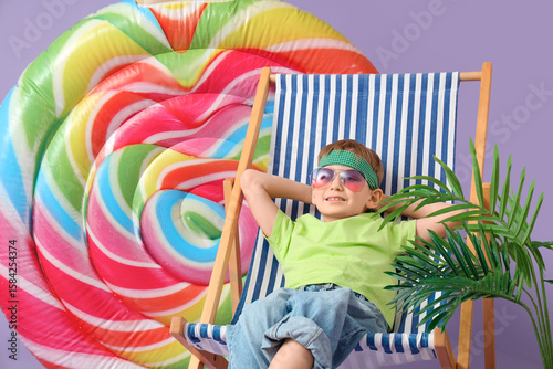 Cute little boy sitting in ...