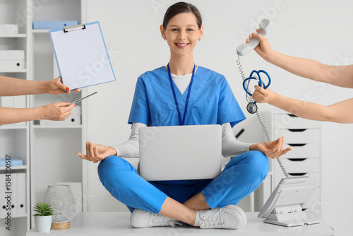 Female doctor meditating on...