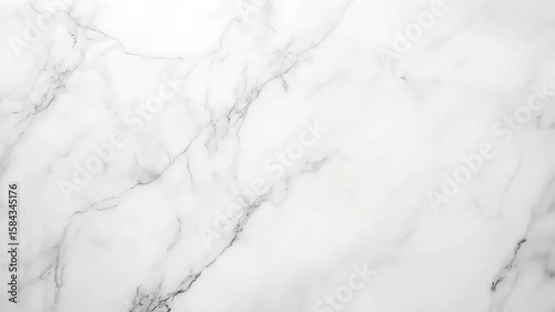 Elegant white marble surface with subtle gray veining, ideal for backgrounds
