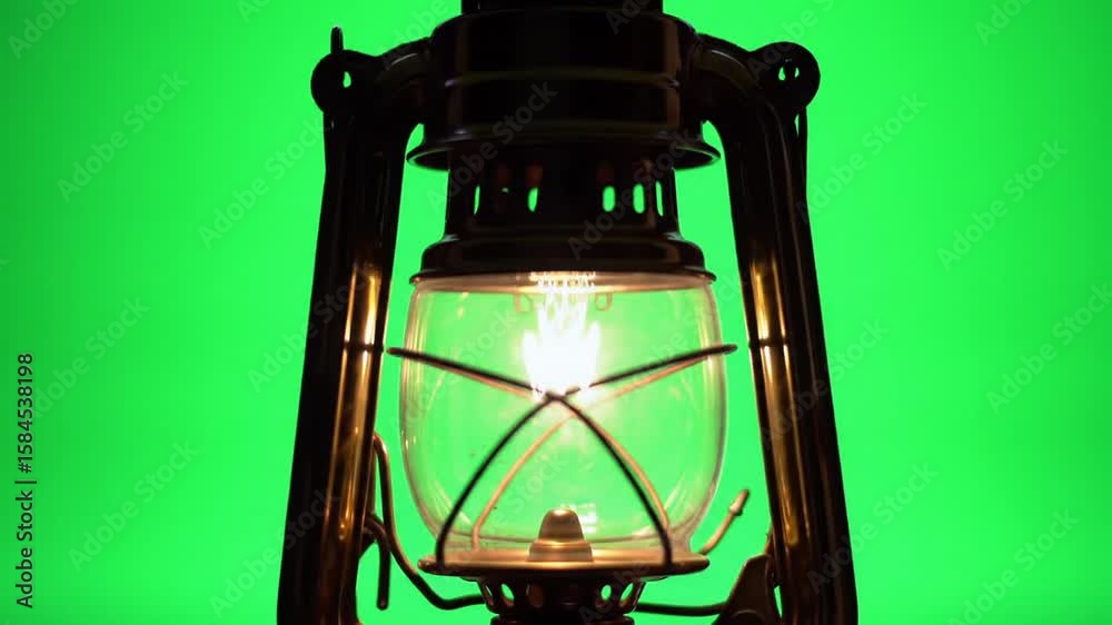 old oil lamp on green background