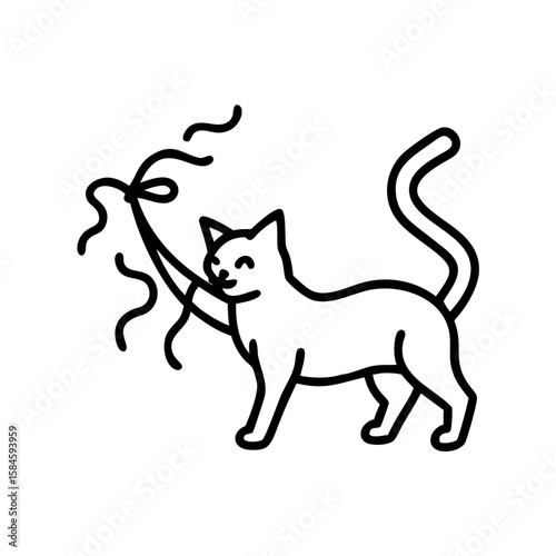 Cat playing with a party streamer and having fun  