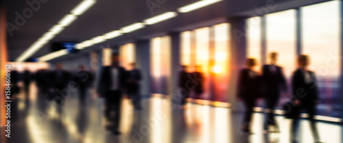 Wallpaper Mural Business people walking in a modern building with large windows and bright sunlight. Torontodigital.ca