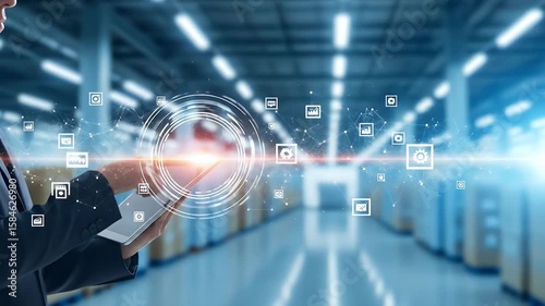 Person using tablet with digital network in warehouse