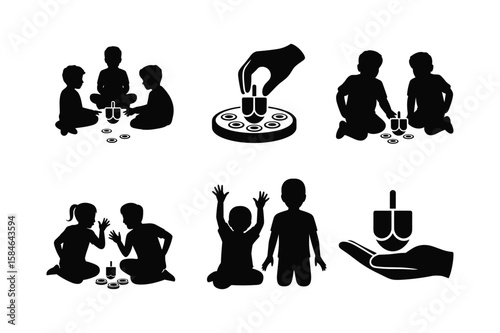 Children playing with dreidels and coins game