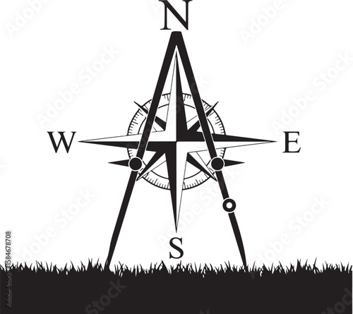 Detailed Black and White Compass Rose Illustration Amidst the Grass Emphasizing Exploration and Nautical Symbolism with Clear Cardinal Directional Markings