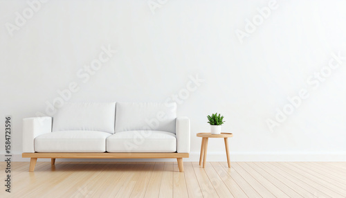 A minimalist living room featuring a white sofa and a small plant on a wooden table against a light wall