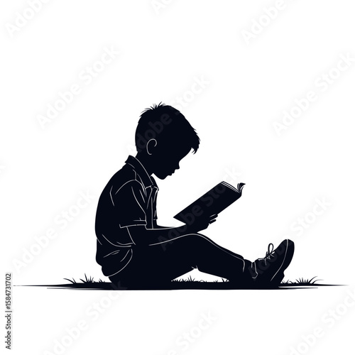 A silhouette of a boy reading a book