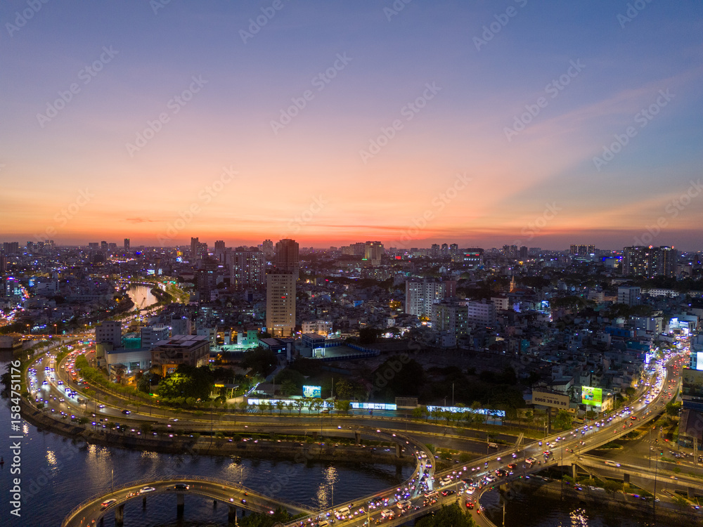 Fototapeta premium Panoramic view of Saigon, Vietnam from above at Ho Chi Minh City's central business district. Cityscape and many buildings, local houses, rivers. Landscape concept.