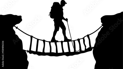 Silhouette of a hiker with backpack crossing a rope bridge between cliffs in a black and white image