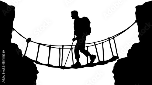 Silhouette of a hiker with a backpack crossing a rope bridge between two cliffs in a mountain pass