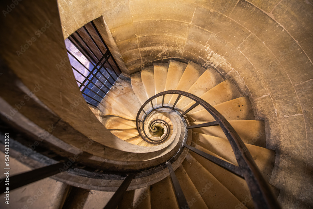 Fototapeta premium A vintage medieval spiral staircase in Paris Pantheon