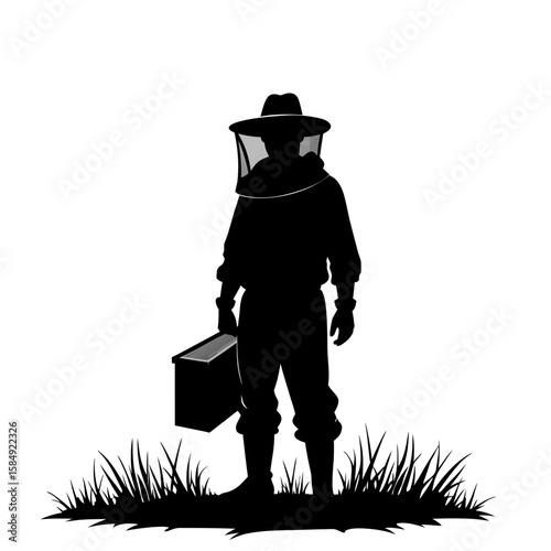Beekeeper in protective suit holding hive box standing in grass veil