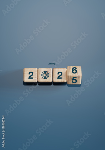Wooden cubes forming year 2025 turning into 2026 with target icon and 