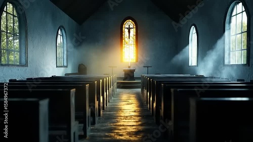 Interior of a church with sunlight streaming through stained glass window