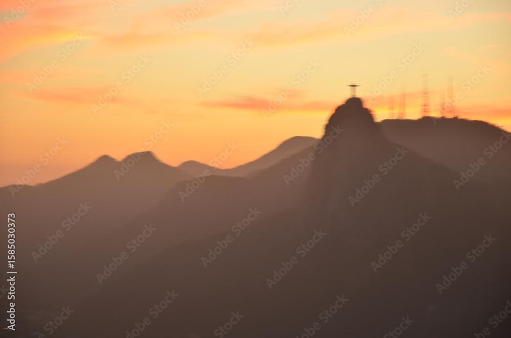 Sunset at night on Rio de Janeiro with city lights and the sea and the mountains Sunset at night on Rio de Janeiro with city lights and the sea and the mountains