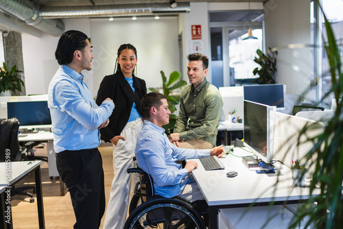 Diverse team working together in an inclusive office environment, demonstrating collaboration and accessibility in the workplace