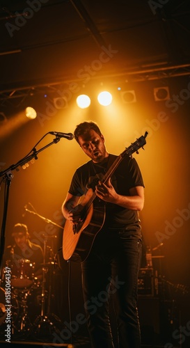 Singer-Songwriter Performing Acoustic Guitar on Stage