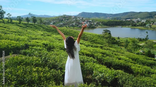 Woman In White Dress Enjoying Tea Fields And Lake Gregory In Sri Lanka