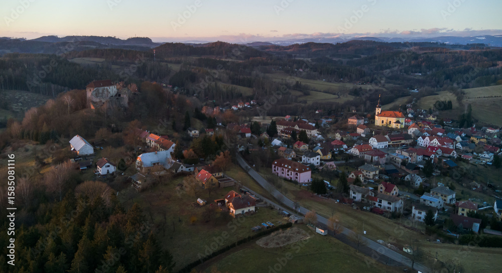 Fototapeta premium The village of Pecka in the foothills of the Krkonoše Mountains with the iconic Pecka Castle