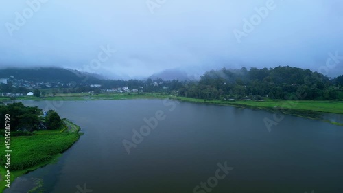 Drone Footage Of Foggy Lake Gregory Surrounded By Lush Green Countryside