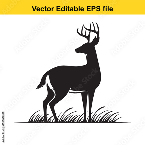 A black deer with antlers stands in the grass