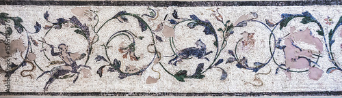 Fragment of Roman mosaic ornament with floral and animal motifs from ancient Corinth, Greece