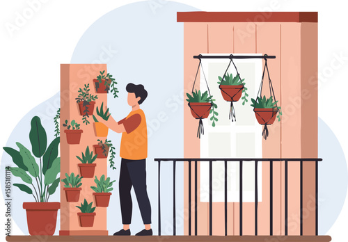 A young man tends to a vertical garden on a balcony, filled with various potted plants.