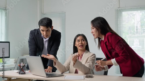 Team collaborating on business project in modern office