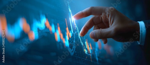 Businessman using virtual screen with stock market graph