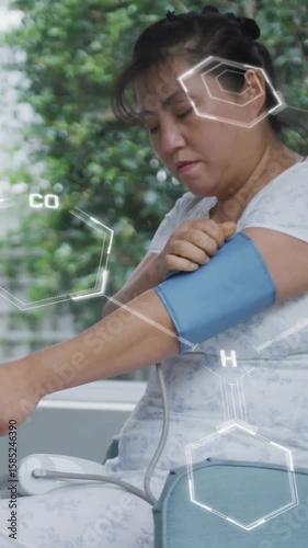 Animation of scientific data processing over woman with blood pressure monitor in hospital